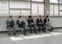 Japanese salarymen waiting for the Shinkansen
